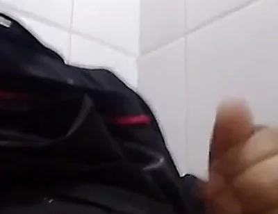 Man Sits in the Bathroom