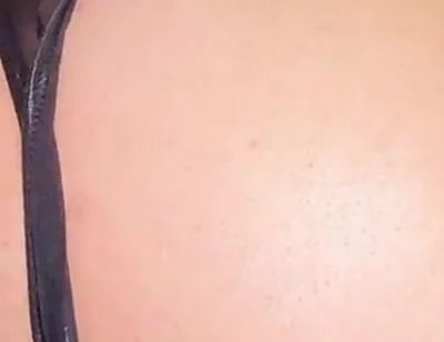 A Gay Man Dressed as a Woman Moves in a Seductive Manner.