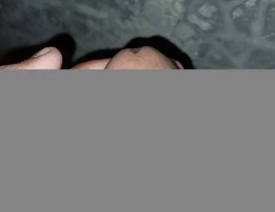 The Gay Boy Went to the Toilet, Turned on the Flash Light on His Mobile Phone, and Started Licking His Private Parts with Spit.