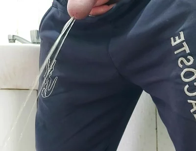 A Well-endowed Brazilian Man Urinating and Showing His Thick Penis to His Female Friends.