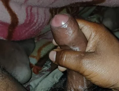 Big Boss massaging penis oil under the blanket