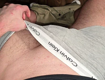 German masked guy rubs huge bulge.. grey Calvins down.. cock dripping heavy