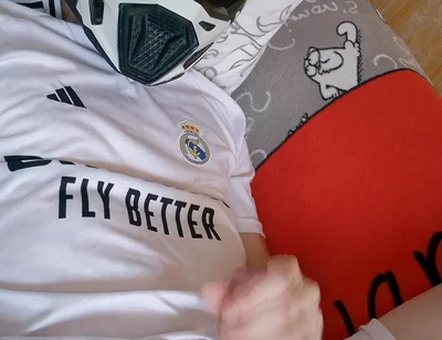 The Guy Is Wearing a Soccer Uniform and Mxhelmet with a Morning Cum