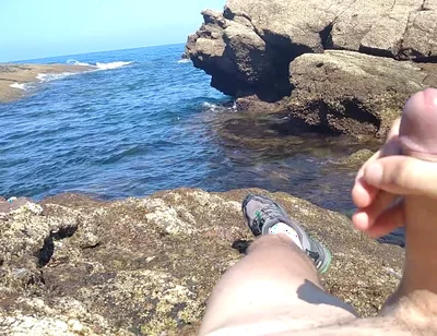 Jerking off a Big Hard Dick Overlooking the Sea in the Beach Cove Until He Cums