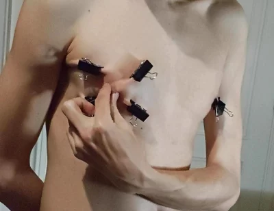Twink Playing with Binder Clips