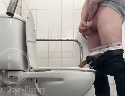 In the Hospital Toilets, a Guy Pisses Into a Cup for a Urine Sample, Then Gets Horny, Jerks-off and Cums