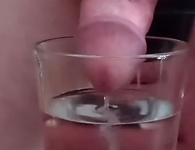 Cumming in a glass of hot water