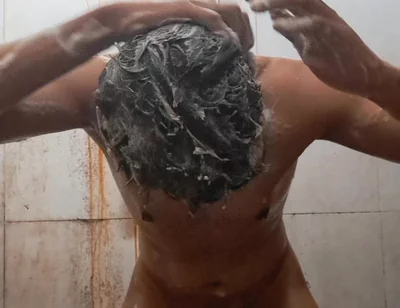 Exotic Skinned Adult Man Taking a Bath in the Afternoon