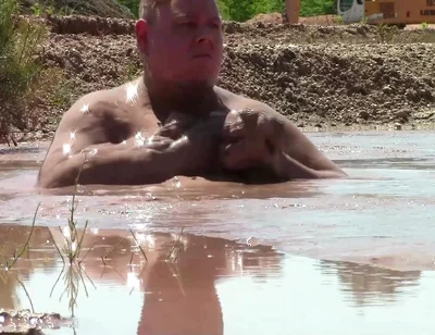 Deep, Creamy Brown Mud Bath in a Sand Pit