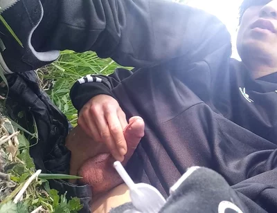 Gay boy Jon Arteen, wearing adidas tracksuit Campus sneakers, gets a hard-on outdoors