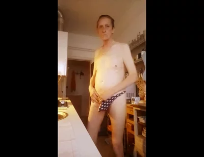 nude in kitchen with hammer in ass