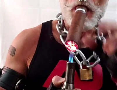 Leather Dad Lighting a Big Ring