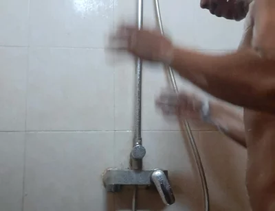 Exotic Skinned Asian Adult Man Taking a Shower in the Morning